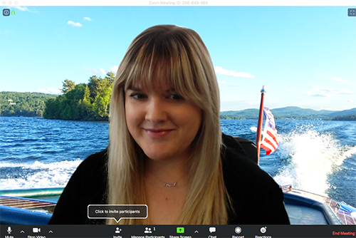 woman with virtual zoom background on a boat on lake george